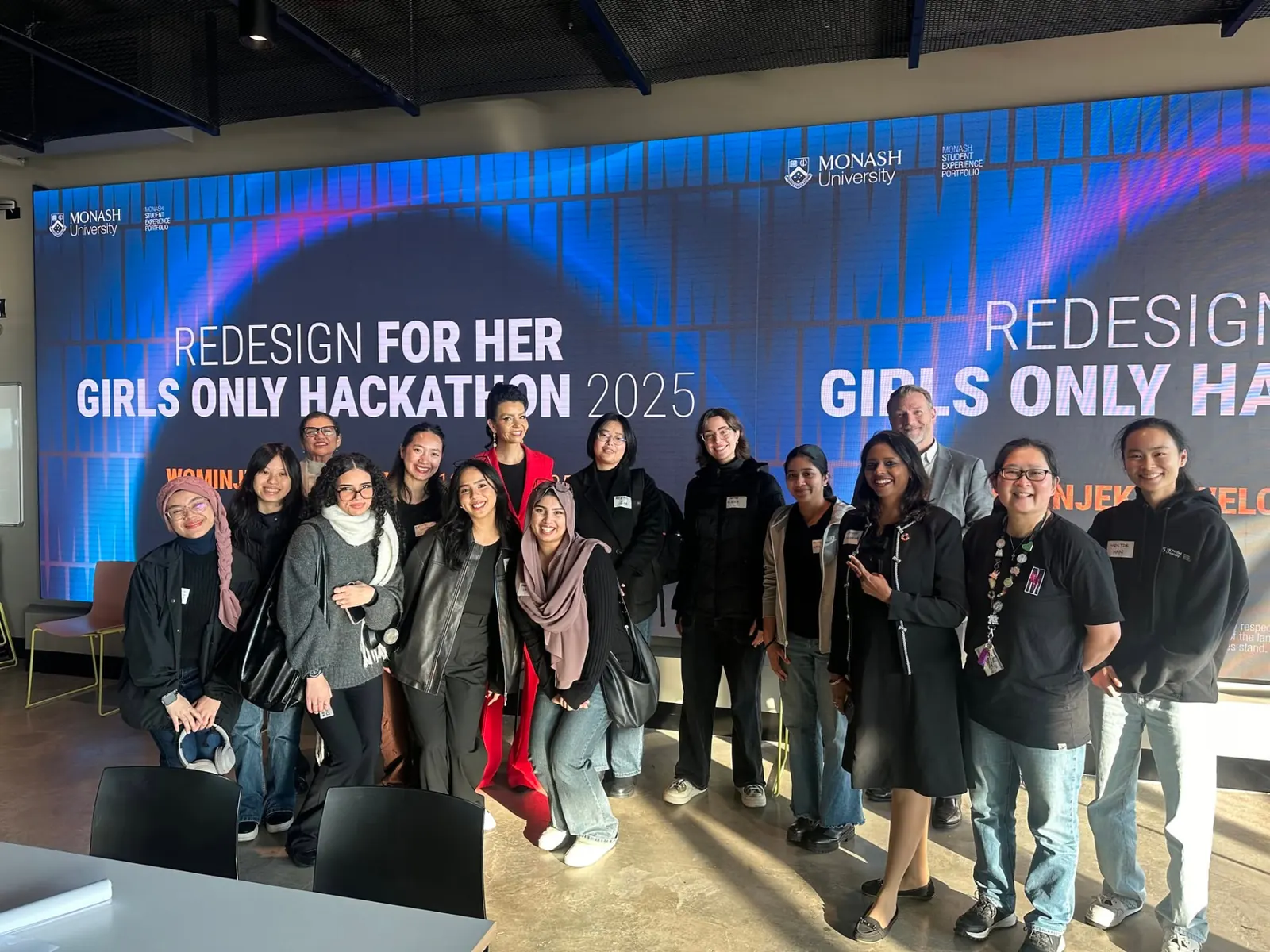 Dr. CeeVee mentoring at the Monash Redesign For Her girls-only hackathon, 2025