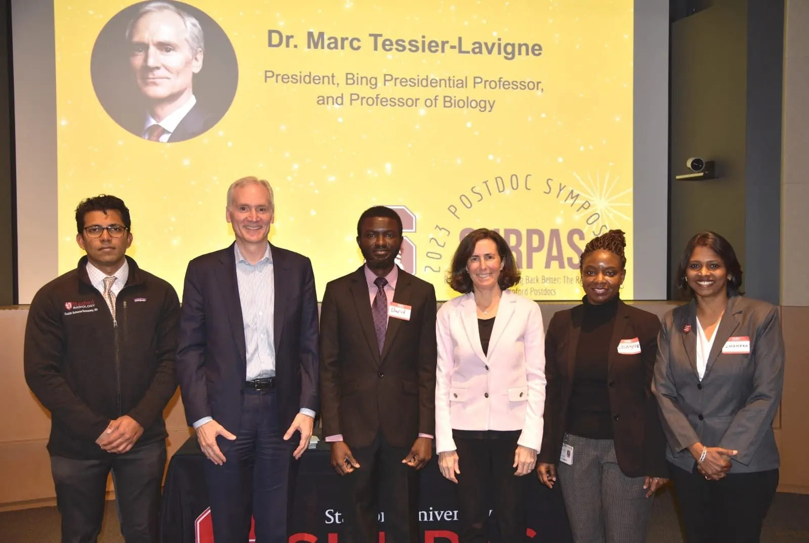 Dr. CeeVee with Stanford President Marc Tessier-Lavigne at the 2023 Postdoc Symposium